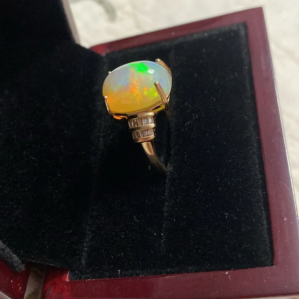AAA Ethiopian Welo 7.56 cwt Opal and G-H SI Diamond Ring in 10 k gold size 7
